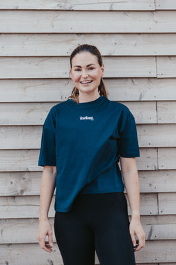 Fern wearing the navy Pilates Prep Club T-shirt, front view with small Radiant chest logo