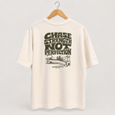 Cream Radiant Pilates T-shirt on wooden hanger, showing olive Chase Strength Not Perfection back graphic