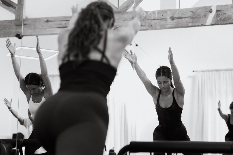 Seated reformer movement at Radiant Woodbury