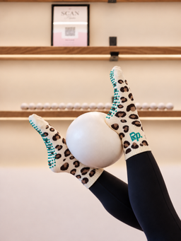 Wild Thing Pilates grip socks - studio Pilates ball pose